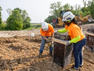 Two people working together