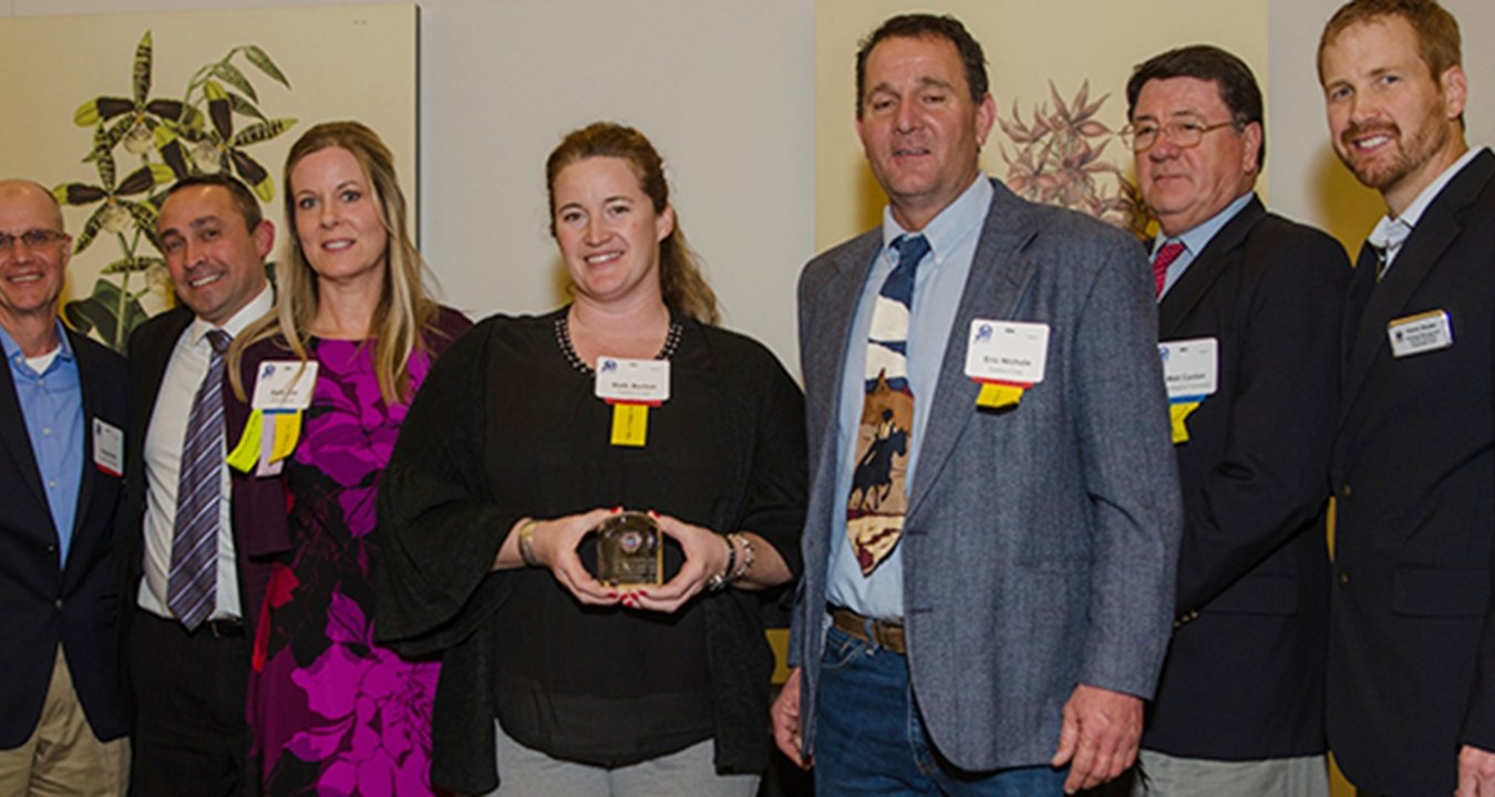 Group of people accepting an award