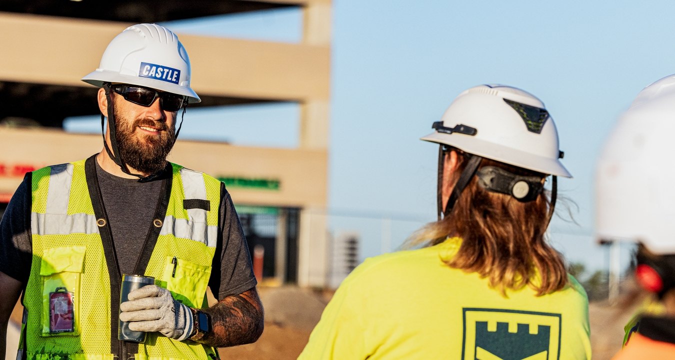 Two people talking on the jobsite