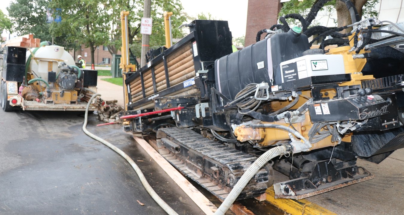 Directional boring along road and walkway