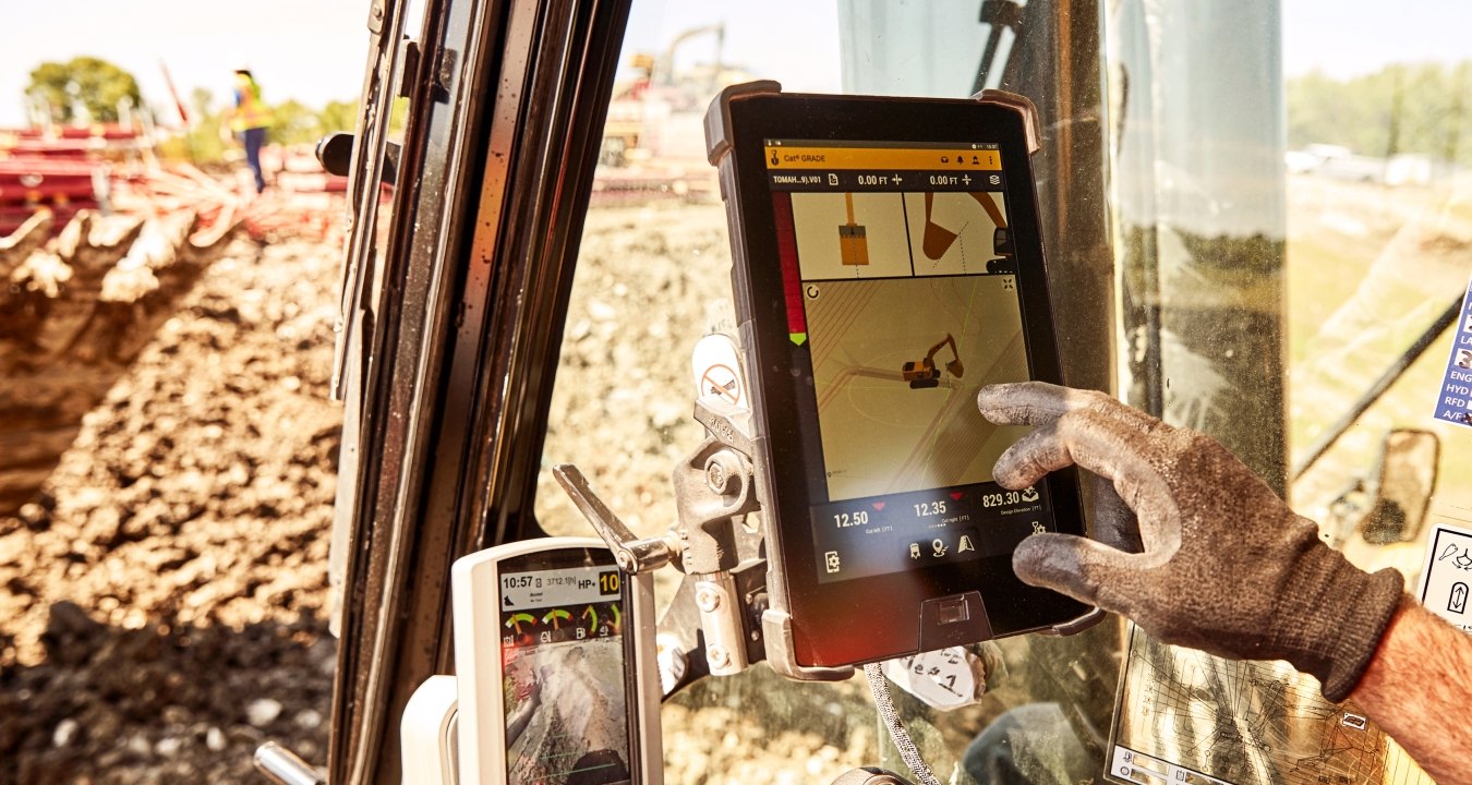 person using technology in excavator