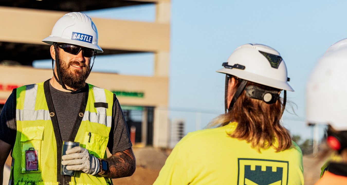 two construction people talking