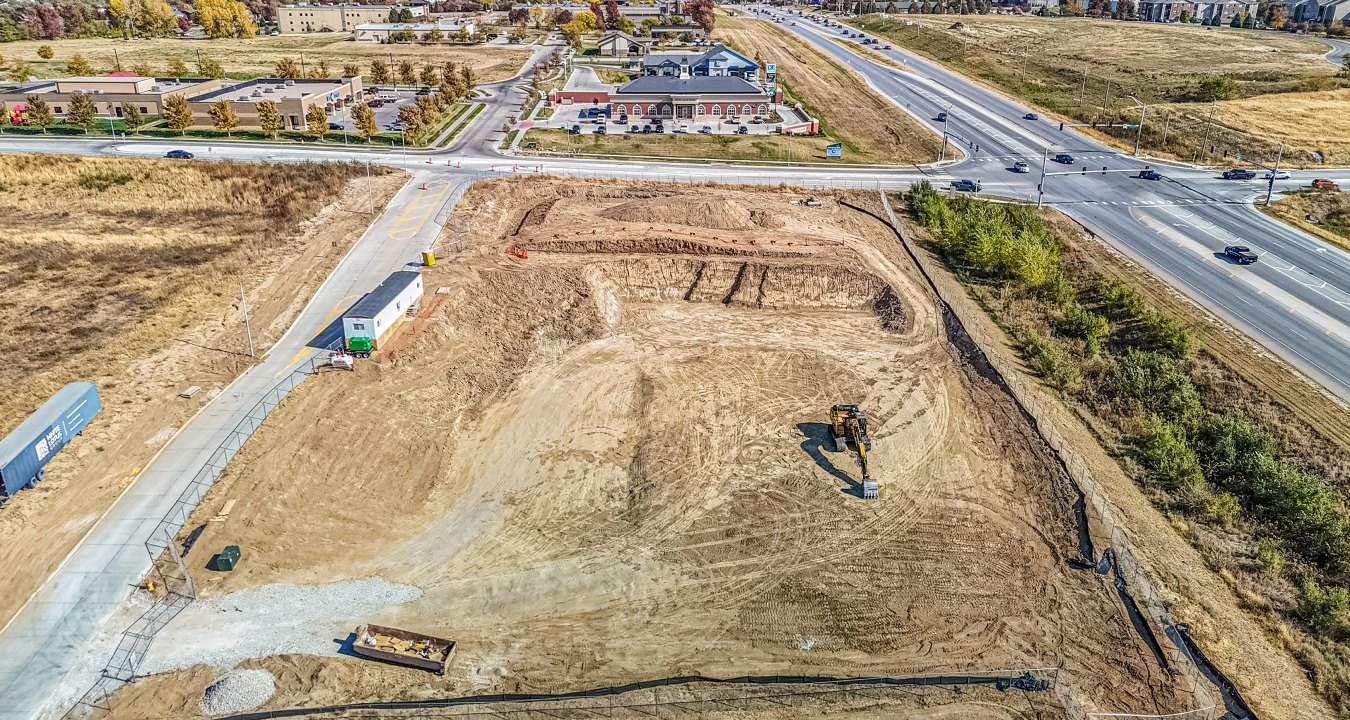 Bird's eye view drone image of leveled jobsite before vertical build