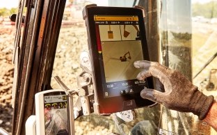 construction person working on his ipad