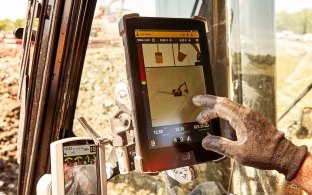 construction worker on a jobsite working on an ipad