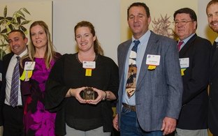 Group of people accepting an award