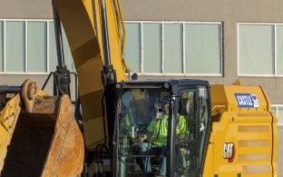 A person operating a piece of equipment