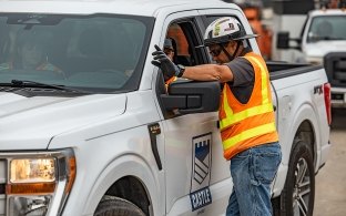 person directing a castle truck