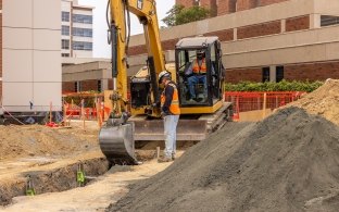 excavator and person on jobsite