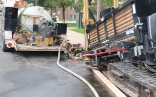 Directional boring along road and walkway