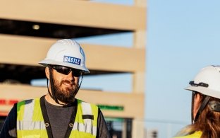 two construction people talking