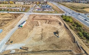 Bird's eye view drone image of leveled jobsite before vertical build