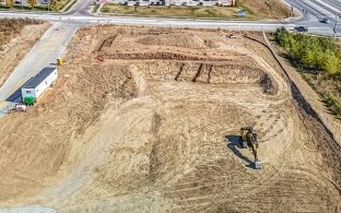 Bird's eye view drone image of leveled jobsite before vertical build