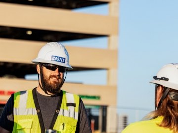 two construction people talking