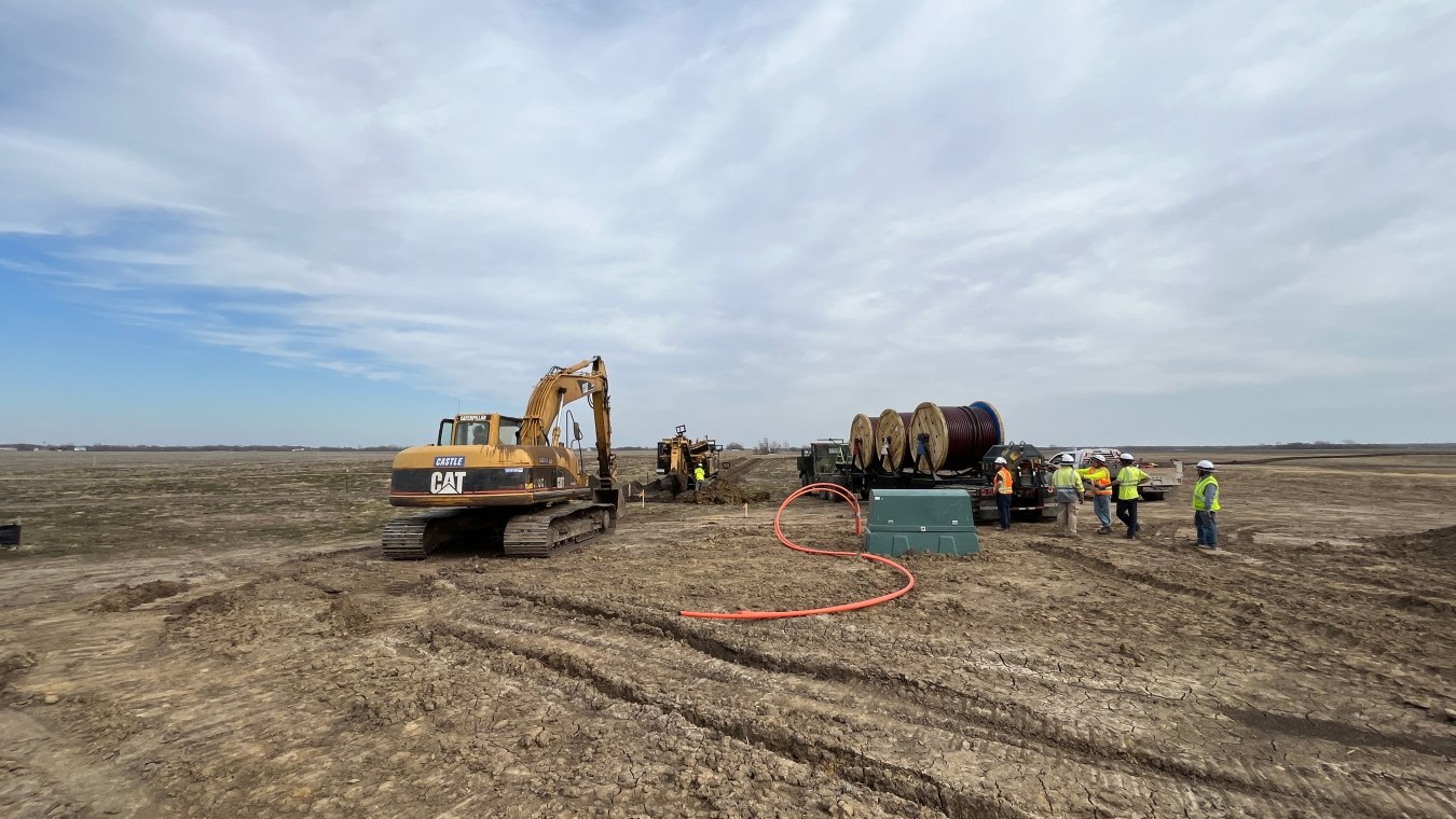 Excavator operating on solar jobsite