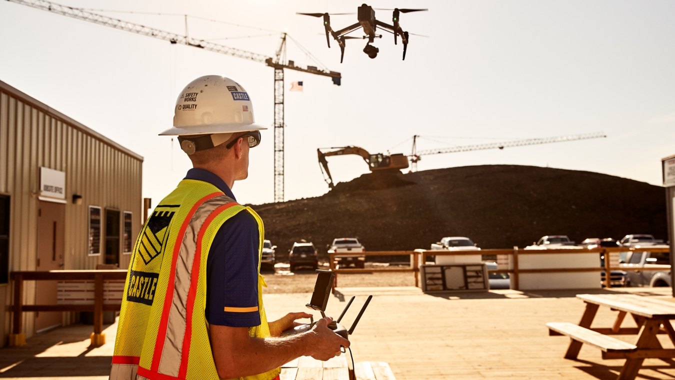 Castle Contracting employee operating aerial drone