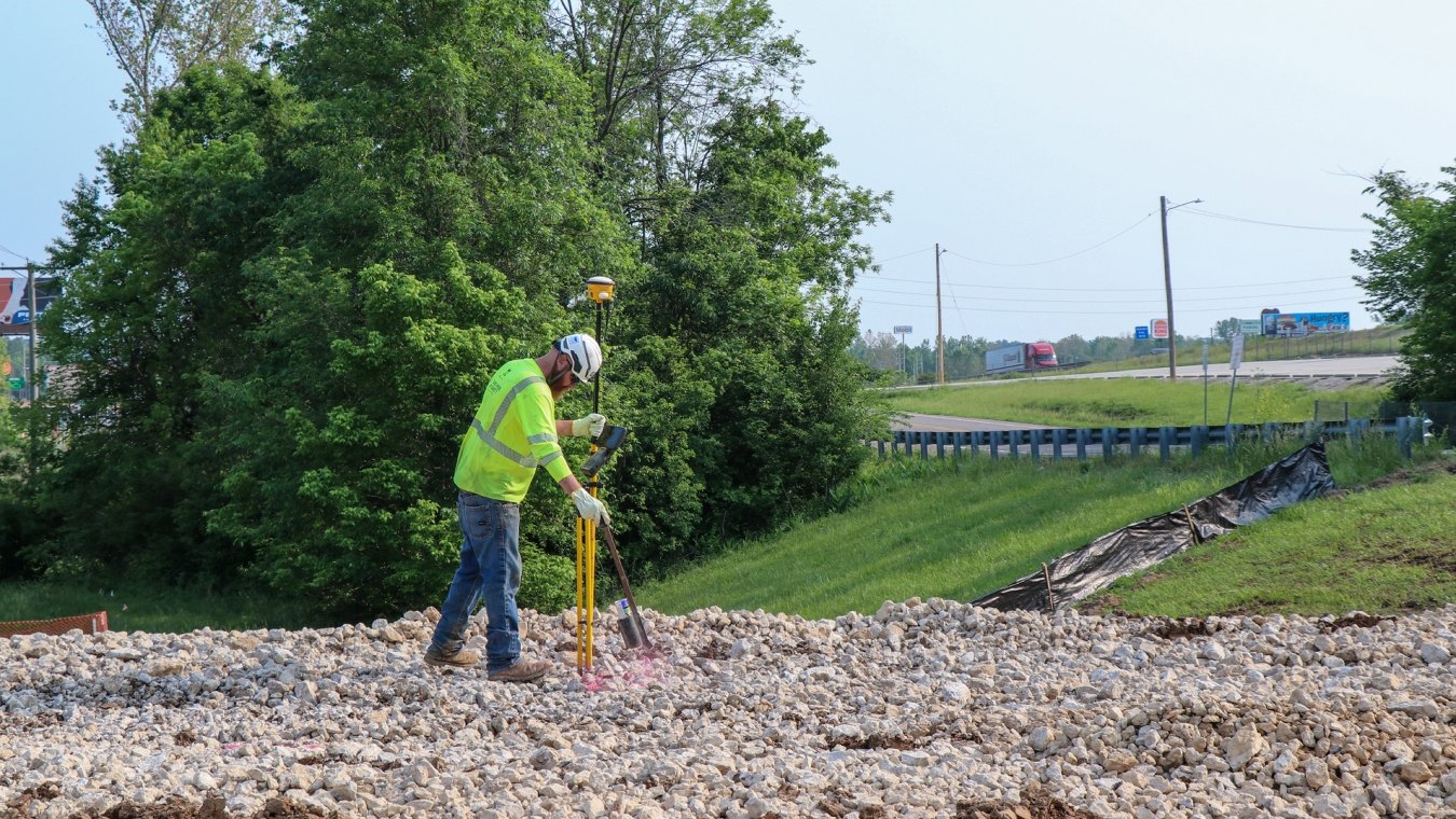 Construction work geo mapping while standing on rocky earth