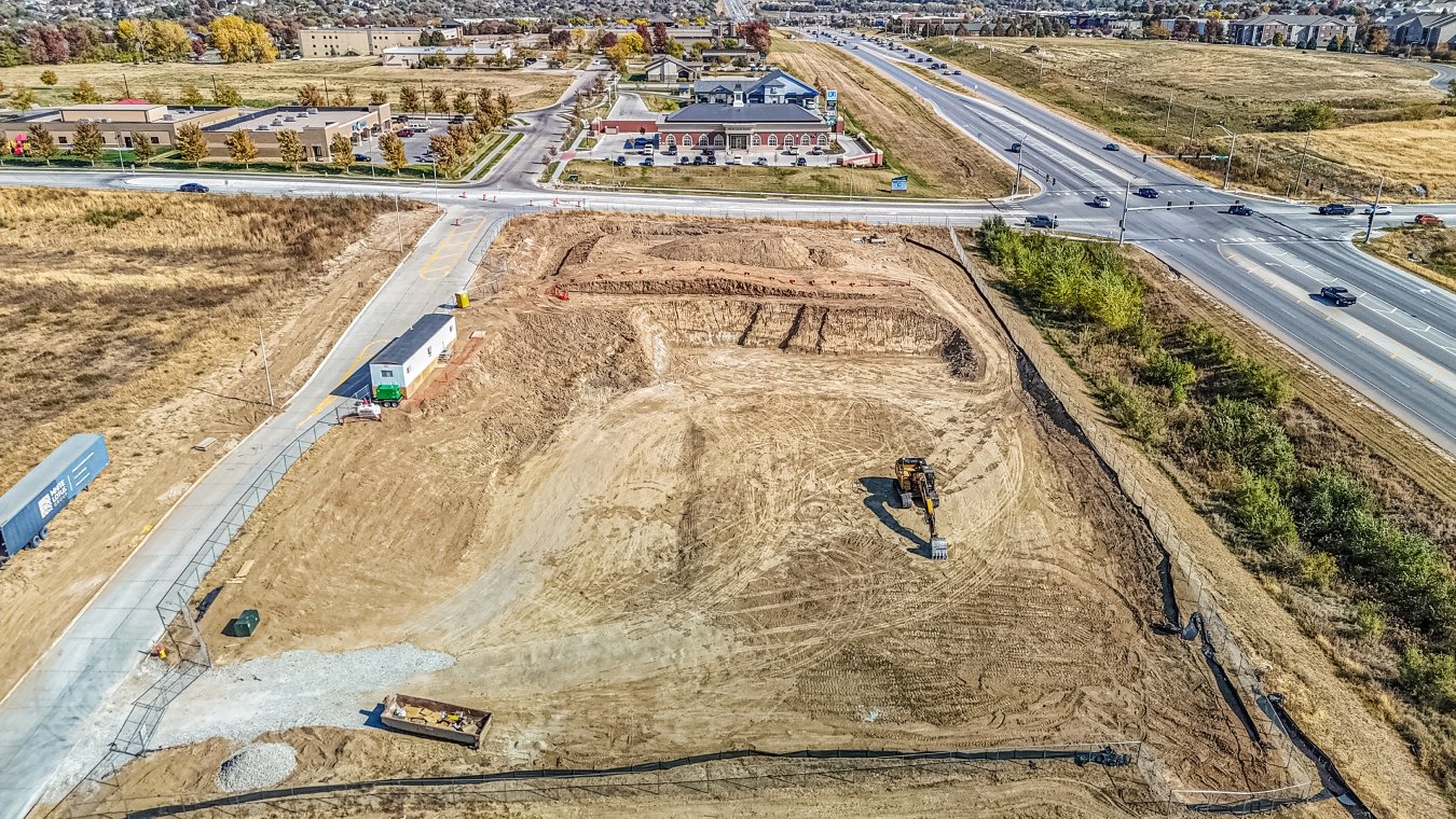 Bird's eye view drone image of leveled jobsite before vertical build