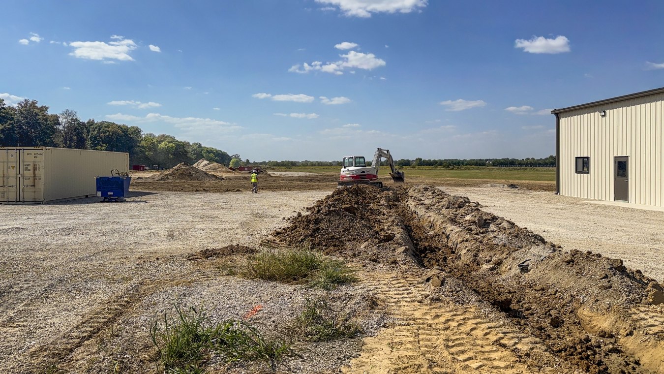Excavated trench toward solar field