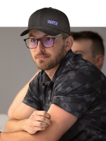 Man wearing a Castle Contracting, LLC. hat