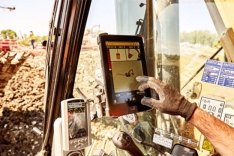 construction worker using a mobile device