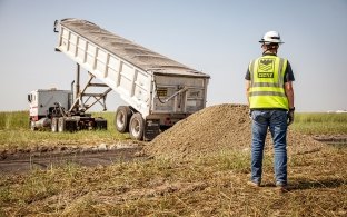 A person standing near a piece of equipment