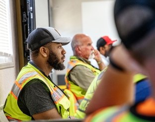 people sitting at a table in a meeting