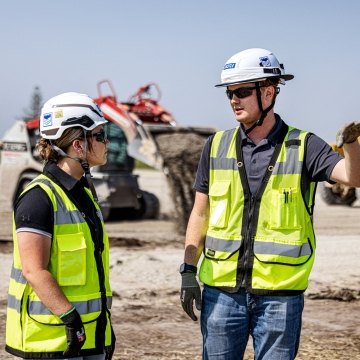 Construction workers collaborating on a jobsite.