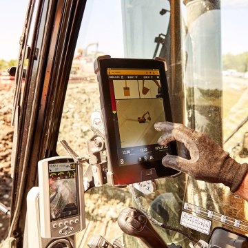construction worker on a jobsite working on an ipad