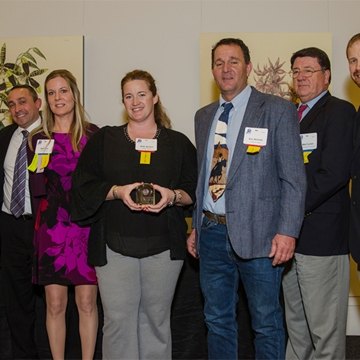 Group of people accepting an award