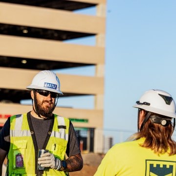 Two people talking on the jobsite