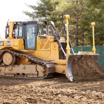 Yellow bulldozer pushing earth