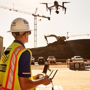 Castle Contracting employee operating aerial drone