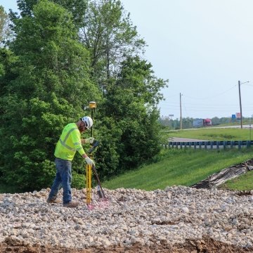 Construction work geo mapping while standing on rocky earth