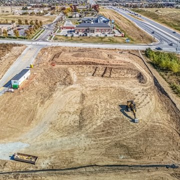 Bird's eye view drone image of leveled jobsite before vertical build
