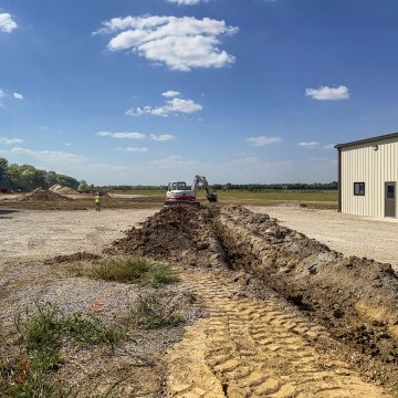 Excavated trench toward solar field